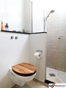 When considering how to make a small bathroom look bigger, consider adding a corner shower. 