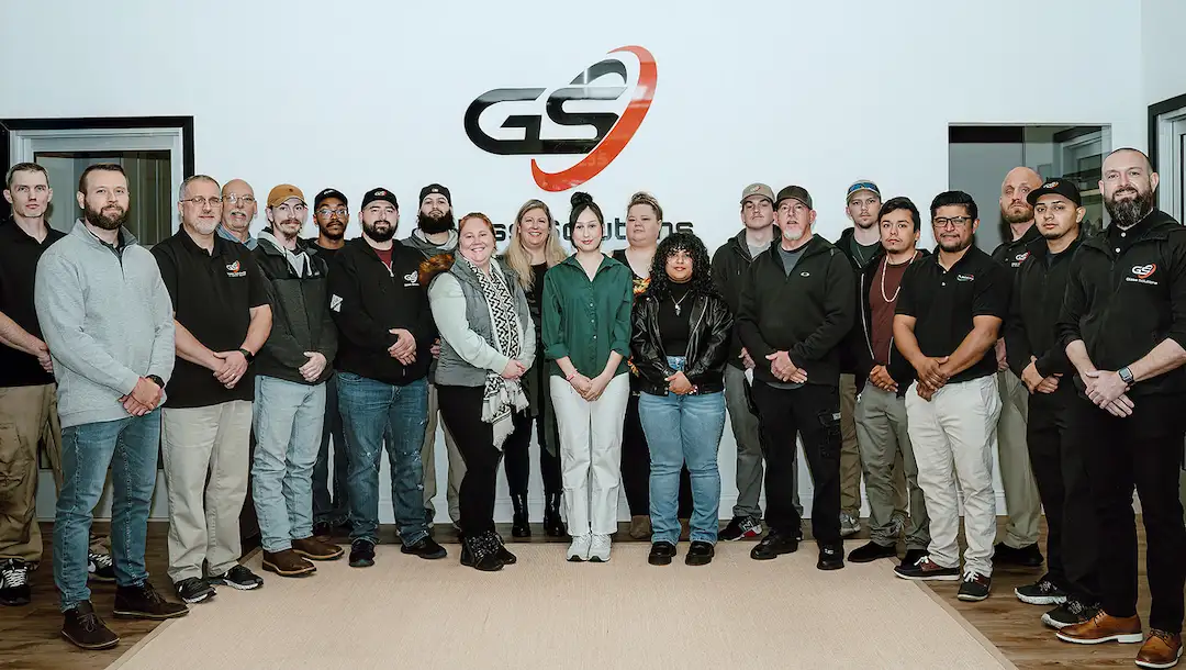 The team of employees at Glass Solutions gets together for a team photo. This Raleigh-based group repairs and installs commercial, residential, and auto glass.