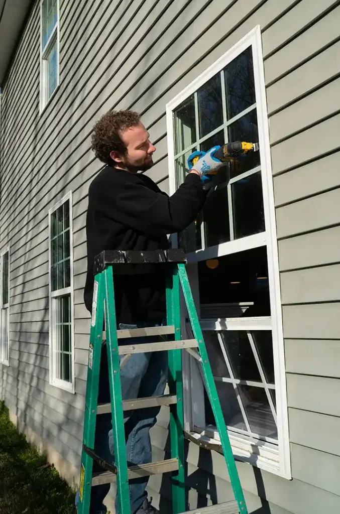 A man fixes a window seal to provides the window repair raleigh nc trusts.