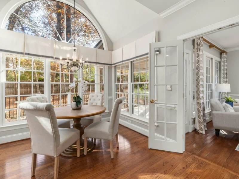 elegant sunlit dining room with large windows. foggy window repair Clayton NC.