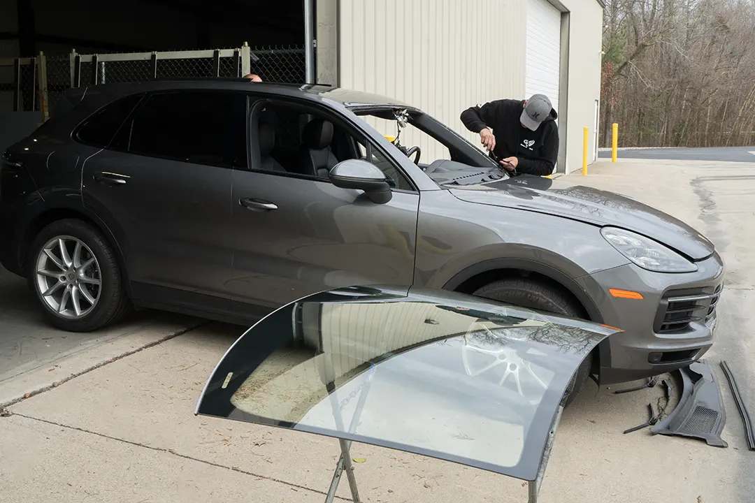 A auto glass technician provides windshield replacement Raleigh.